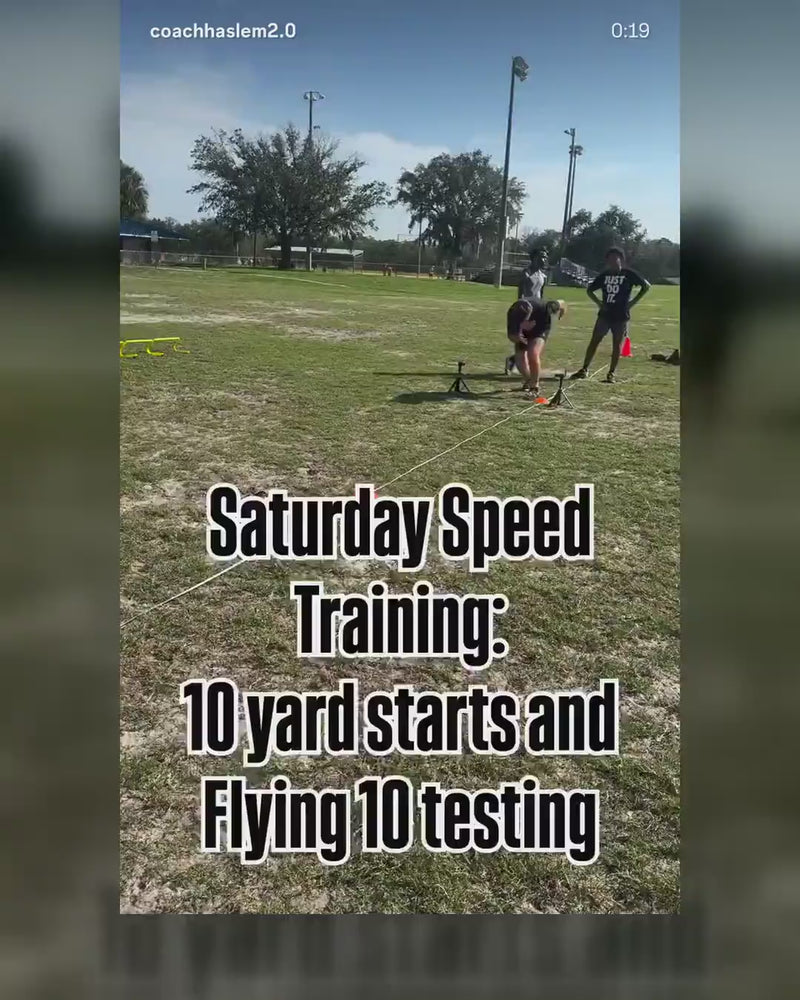 Saturday speed training session with athletes running 10-yard starts along a measured line set with EZCones and timing gates.